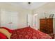 This bedroom features a closet, dresser, and comfortable bed at 4015 Broadview Ln, Gastonia, NC 28056