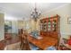 Dining room with hardwood floors, dining table, chandelier and china cabinet at 4015 Broadview Ln, Gastonia, NC 28056