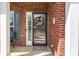 Inviting front porch leads to the home's entrance, featuring a welcome mat and spring themed door wreath at 4015 Broadview Ln, Gastonia, NC 28056