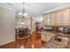 Bright kitchen with granite countertops, hardwood floors, and views into the dining area at 4015 Broadview Ln, Gastonia, NC 28056