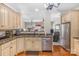 Spacious kitchen with stainless steel appliances, granite countertops, and hardwood floors at 4015 Broadview Ln, Gastonia, NC 28056