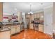 Charming kitchen featuring stainless steel appliances, granite countertops, and hardwood floors at 4015 Broadview Ln, Gastonia, NC 28056