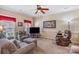 Cozy living room features neutral carpet, crown molding, and an array of comfortable seating options at 4015 Broadview Ln, Gastonia, NC 28056