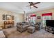 Spacious living room features neutral carpet, crown molding, and an array of comfortable seating options at 4015 Broadview Ln, Gastonia, NC 28056