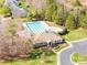 Aerial view of a neighborhood pool with lap lanes, a clubhouse and a parking lot at 4015 Broadview Ln, Gastonia, NC 28056