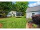 Backyard featuring a shed, trampoline, and lush greenery. Great outdoor space at 503 Azure Ave, Albemarle, NC 28001