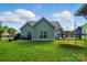 Spacious backyard with a well-maintained lawn, patio seating, and a trampoline at 503 Azure Ave, Albemarle, NC 28001