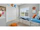 Bright bedroom featuring a unique bed frame with built-in storage and sporty basketball decor at 503 Azure Ave, Albemarle, NC 28001