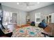 Versatile bonus room with wood flooring, featuring comfortable seating and easy access to adjacent rooms at 503 Azure Ave, Albemarle, NC 28001