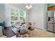 Cozy dining area featuring built-in bench seating, large windows, and a view of the backyard at 503 Azure Ave, Albemarle, NC 28001