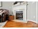 Close-up of the fireplace with decorative mantel, hearth and gas logs at 503 Azure Ave, Albemarle, NC 28001