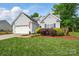 Charming single-Gathering home featuring a two-car garage, well-maintained lawn, and traditional siding at 503 Azure Ave, Albemarle, NC 28001