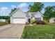 Charming single-Gathering home featuring a two-car garage, well-maintained lawn, and traditional siding at 503 Azure Ave, Albemarle, NC 28001