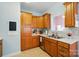 Traditional kitchen featuring wooden cabinets, stainless steel appliances, and a bright and airy design at 503 Azure Ave, Albemarle, NC 28001