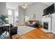 Spacious living room with fireplace, hardwood floors, high ceilings and lots of light at 503 Azure Ave, Albemarle, NC 28001