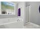 Relaxing bathroom featuring a large soaking tub, separate shower, and modern fixtures at 503 Azure Ave, Albemarle, NC 28001