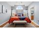 Stylish main bedroom featuring a large arched window, hardwood floors, and a comfortable layout at 503 Azure Ave, Albemarle, NC 28001