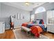 Well-lit main bedroom with hardwood floors, arched window, neutral decor, and cozy furnishings at 503 Azure Ave, Albemarle, NC 28001