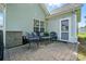 Paver patio with outdoor seating and a small table. Good view of the house and backyard at 503 Azure Ave, Albemarle, NC 28001