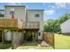 Backyard view of deck and partial view of yard and landscape at 513 Lex Dr, Charlotte, NC 28262