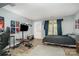Spacious bedroom featuring wood floors, an entertainment center, and direct access to the outside at 513 Lex Dr, Charlotte, NC 28262