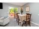 Cozy dining area featuring a table for four and sliding glass door to the outdoor balcony at 513 Lex Dr, Charlotte, NC 28262