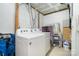 Functional laundry room with white appliances, storage, and utility connections at 513 Lex Dr, Charlotte, NC 28262