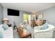 Comfortable living room with a dining area, featuring carpeted floors and sliding glass door at 513 Lex Dr, Charlotte, NC 28262