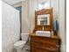 Bathroom with blue tiled walls and a unique antique vanity with vessel sink at 5301 Meadowcroft Way, Fort Mill, SC 29708