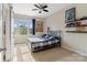 Bright bedroom featuring a single bed, plush carpet, and a large window with a view at 5301 Meadowcroft Way, Fort Mill, SC 29708