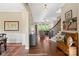 Inviting foyer with hardwood floors, decorative rugs, staircase, and elegant decor at 5301 Meadowcroft Way, Fort Mill, SC 29708
