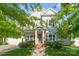 Charming two-story home featuring a red front door, manicured lawn, and an inviting porch with an American flag at 5301 Meadowcroft Way, Fort Mill, SC 29708