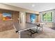 Recreation room with ping pong table, brick accent wall, and natural light at 5301 Meadowcroft Way, Fort Mill, SC 29708