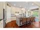 Island kitchen featuring pendant lighting, barstool seating, stainless steel appliances, and granite countertops at 5301 Meadowcroft Way, Fort Mill, SC 29708