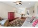 Relaxing living room featuring a large rug, comfortable seating, and a red cabinet at 5301 Meadowcroft Way, Fort Mill, SC 29708