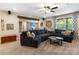 Cozy living room with dark blue sectional sofa, stylish decor, and natural light at 5301 Meadowcroft Way, Fort Mill, SC 29708
