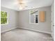 Well-lit bedroom with two windows offering natural light and a ceiling fan, perfect for a comfortable living space at 543 Hampton St, Rock Hill, SC 29730