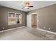 Bright and open bedroom featuring neutral walls, plush carpet, and large windows offering ample natural light at 543 Hampton St, Rock Hill, SC 29730