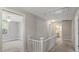 Hallway featuring white railing leading to an upstairs room and bathroom at 543 Hampton St, Rock Hill, SC 29730