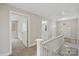 Bright hallway featuring neutral walls and carpet, leading to bedrooms with natural light and white-painted trim at 543 Hampton St, Rock Hill, SC 29730
