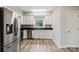 Well-lit kitchen with stainless steel appliances, white cabinets, and a granite countertop at 543 Hampton St, Rock Hill, SC 29730