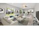 Open living room featuring a sofa, dining table, and view to the backyard at 543 Hampton St, Rock Hill, SC 29730