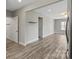 Open living room featuring hardwood floors and a door to another room at 543 Hampton St, Rock Hill, SC 29730