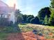Spacious backyard with trees and an old fence in need of landscaping at 6000 S Main St, Salisbury, NC 28147