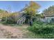 Exterior view of a back porch and overgrown vegetation near driveway at 6000 S Main St, Salisbury, NC 28147