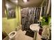 View of a bathroom with a toilet, sink, and shower at 6000 S Main St, Salisbury, NC 28147