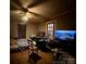 This bedroom features a ceiling fan, window, and is furnished with a bed, chair, and shelves at 6000 S Main St, Salisbury, NC 28147