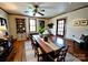 Spacious dining room featuring a long wooden table with a neutral-toned table runner and chairs, complemented by built-in shelving at 6000 S Main St, Salisbury, NC 28147