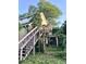 Exterior of home featuring stairs and overgrown foliage, creating a nature-filled setting at 6000 S Main St, Salisbury, NC 28147