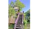 Exterior of house featuring stairs and overgrown vines, creating a whimsical, nature-filled entrance at 6000 S Main St, Salisbury, NC 28147